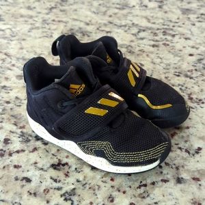 Kids black and gold Adidas shoes